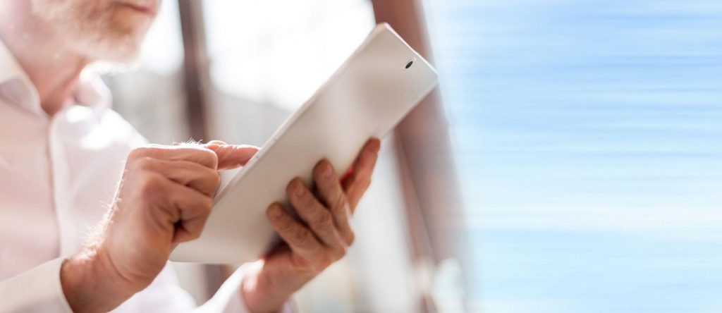 Senior citizen using a tablet